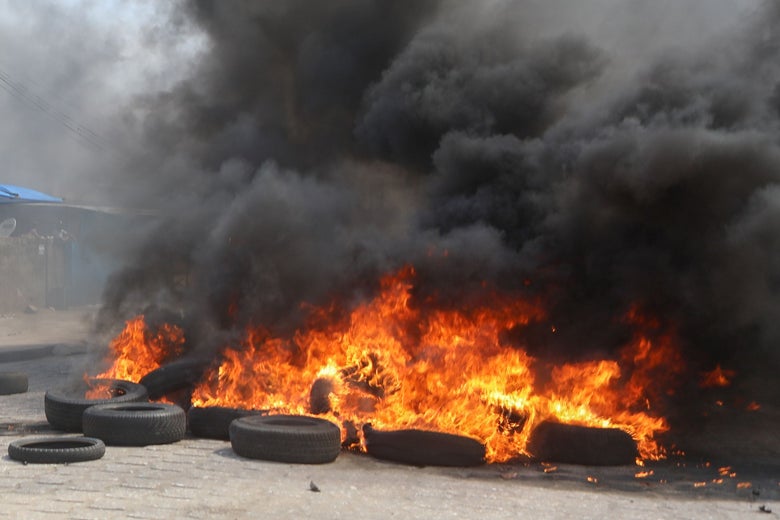 A flaming pile of tires.
